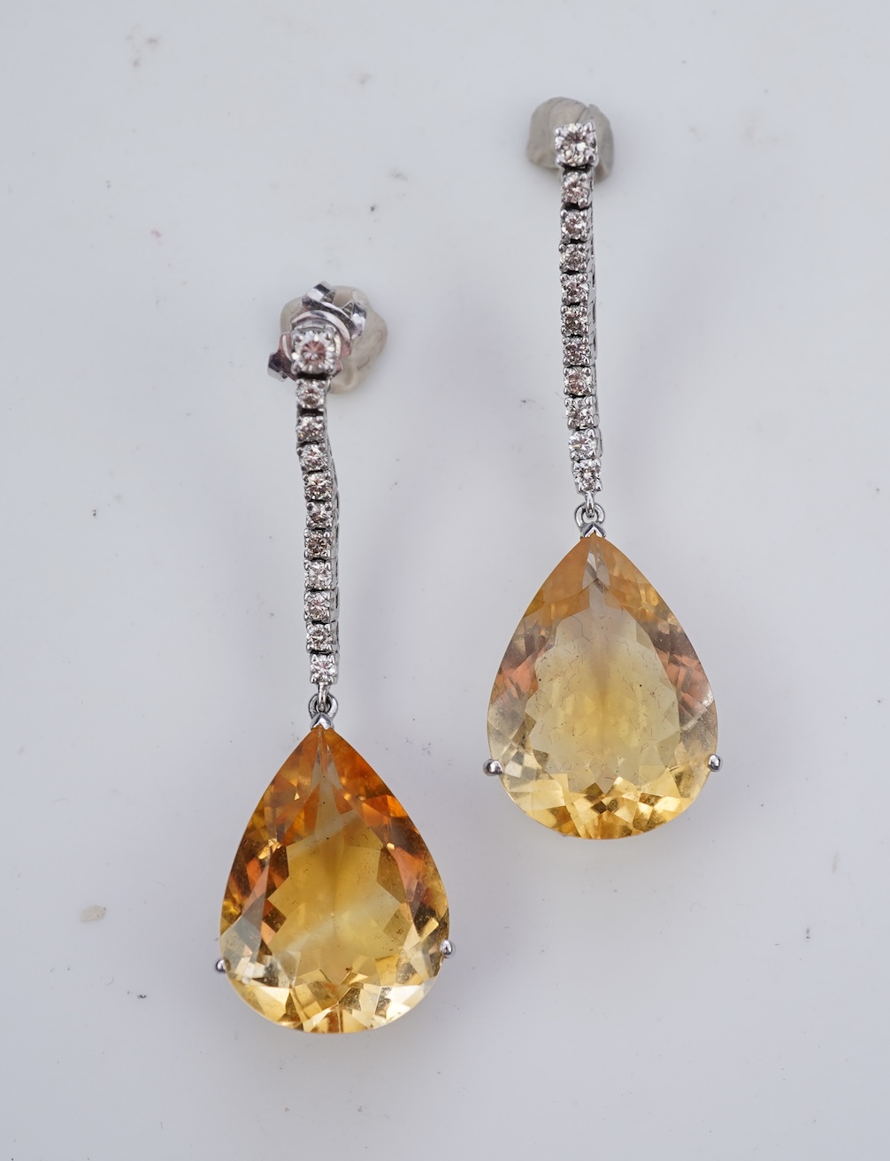 A pair of citrine and diamond earrings